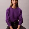 Arkistologolla varustettu rento fleece-huppari Arkistologolla varustettu rento fleece-huppari