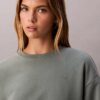 Arkistologolla varustettu rento fleece-huppari Arkistologolla varustettu rento fleece-huppari