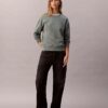Arkistologolla varustettu rento fleece-huppari Arkistologolla varustettu rento fleece-huppari