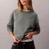Arkistologolla varustettu rento fleece-huppari Arkistologolla varustettu rento fleece-huppari