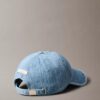 Denim-baseball-lippis, jossa on koko pinnan kattava logomerkki Denim-baseball-lippis, jossa on koko pinnan kattava logomerkki