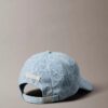 Denim-baseball-lippis, jossa on koko pinnan kattava logomerkki Denim-baseball-lippis, jossa on koko pinnan kattava logomerkki