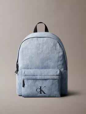 Denim-monogramilogolla varustettu reppu