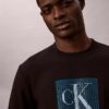 Fleece-kerrostettu Monogram-kuviollinen collegepaita Fleece-kerrostettu Monogram-kuviollinen collegepaita