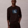 Fleece-kerrostettu Monogram-kuviollinen collegepaita Fleece-kerrostettu Monogram-kuviollinen collegepaita