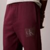 Fleece-kerrostetut Monogram-kuvioiset verryttelyhousut Fleece-kerrostetut Monogram-kuvioiset verryttelyhousut