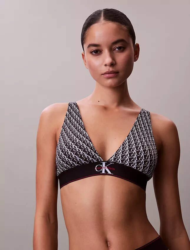 Graafinen monogrammi-Microfiber-kuituinen joustava, kevyesti vuorattu kolmiomallinen Bralette Graafinen monogrammi-Microfiber-kuituinen joustava, kevyesti vuorattu kolmiomallinen Bralette
